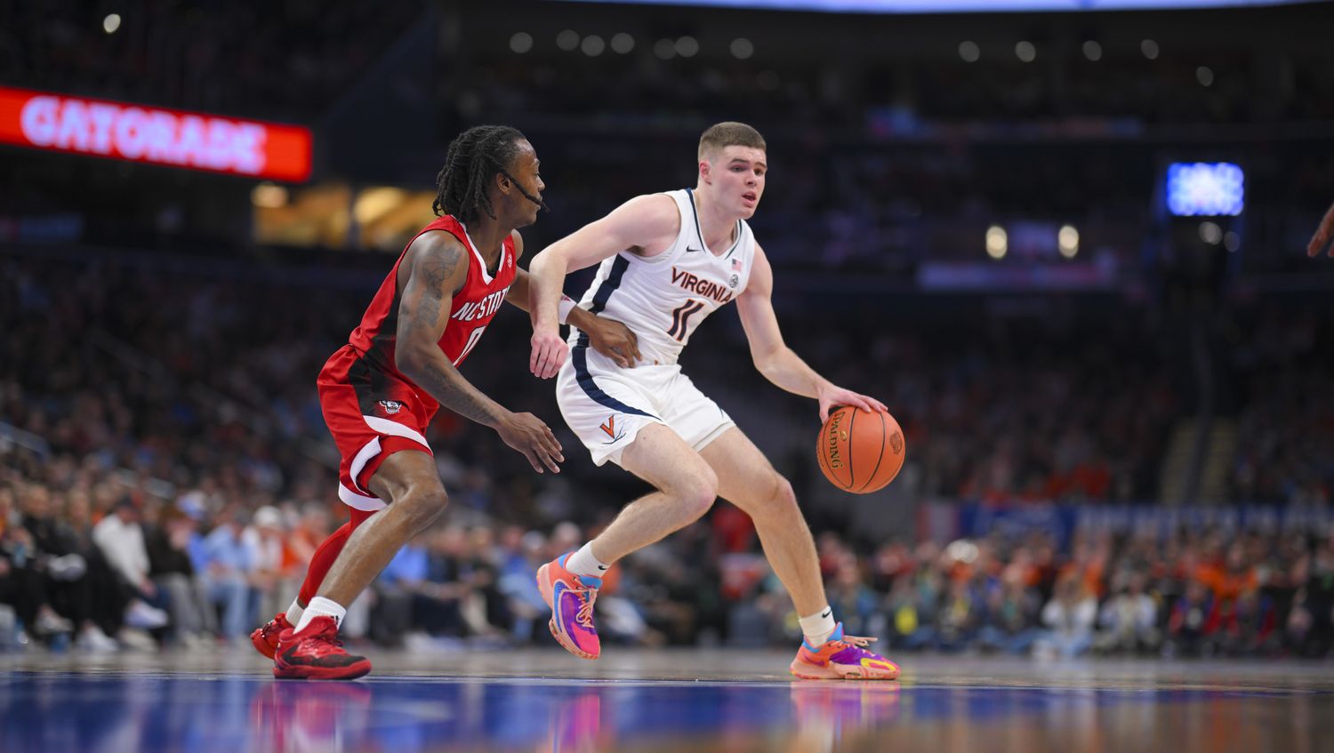Isaac McKneely handles the ball during the Virginia men's basketball game against NC State in the semifinals of the 2024 ACC Men's Basketball Tournament at Capital One Arena.